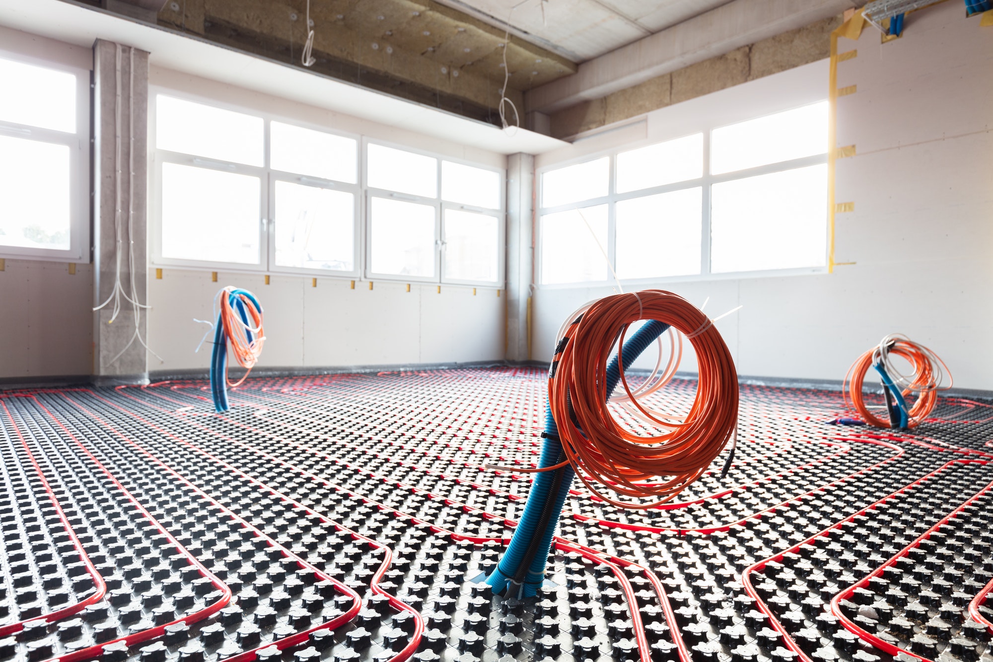 Floor heating and electrical outputs in a new building. Interior design